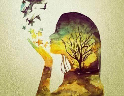 Silüet şekilindeki kadın ağzından kuş ve yıldız üflüyor