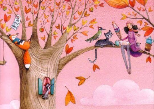 sonbaharda ağaçta hayvanlar ile oturan kadın