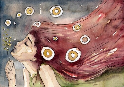 çiçeğe üfleyen kız