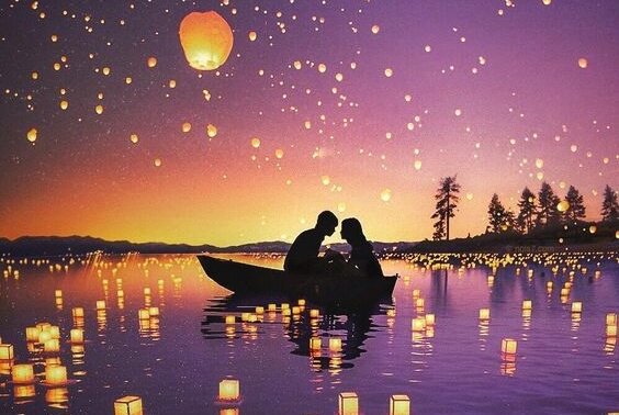 uçan fenerlerle dolu gölde, saldaki çift